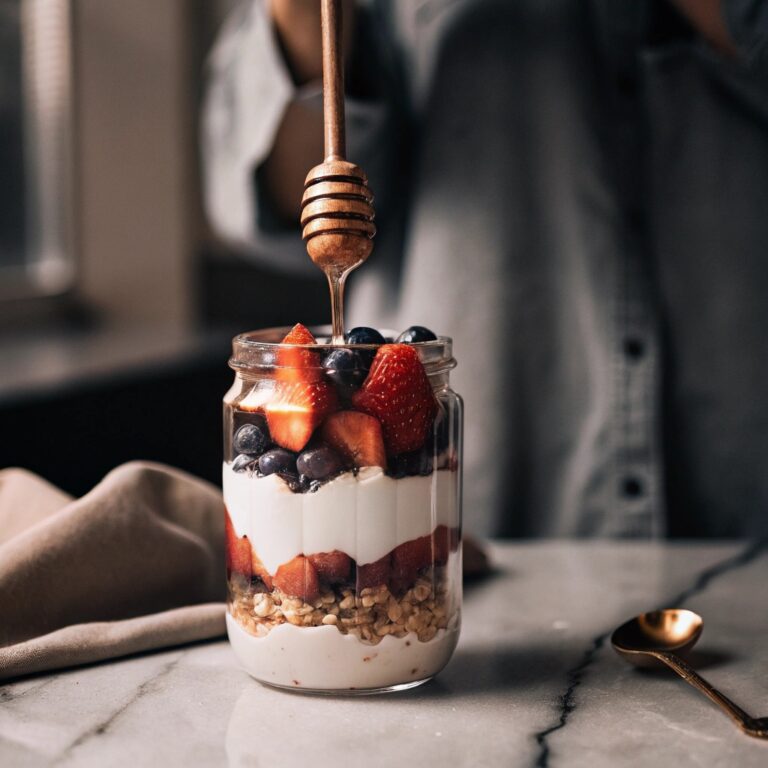 Greek Yogurt Dessert Recipes That Are Irresistibly Healthy and Easy 6 No-bake Greek yogurt parfait with berries, granola, and honey in a glass jar